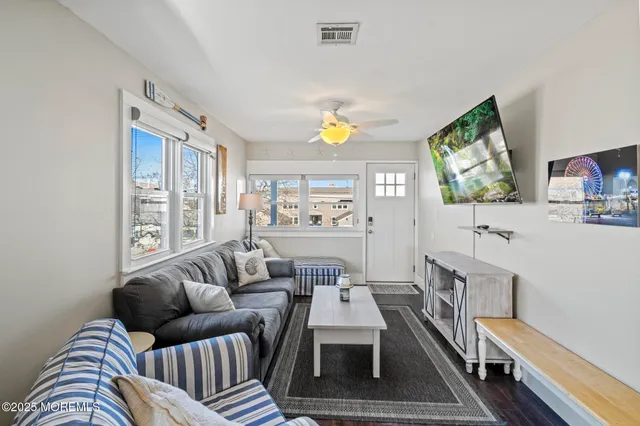 a kitchen with stainless steel appliances a stove a sink and a refrigerator