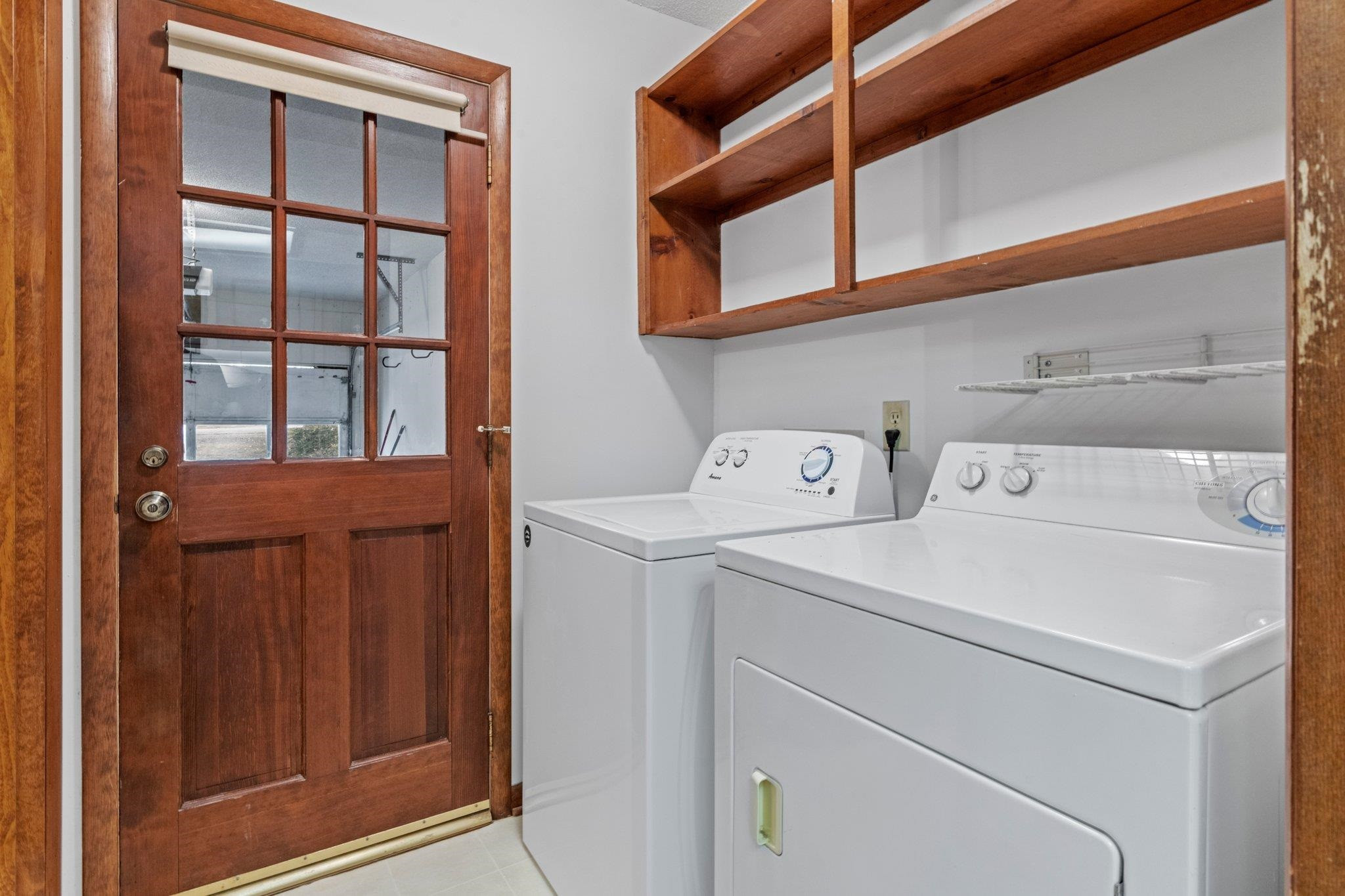 7829 Breckon Way Raleigh, NC 27615 - Photo 13 of 40 Access from garage into mudroom with laundry area. Mudroom/Laundry Room