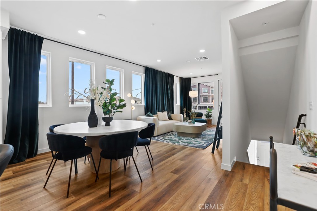 42 Bigsby Drive Stanton, CA 90680 - Photo 11 of 40 a view of a dining room with furniture window and wooden floor