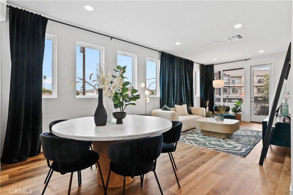 42 Bigsby Drive Stanton, CA 90680 - Photo 12 of 40 a dining room with furniture window and wooden floor
