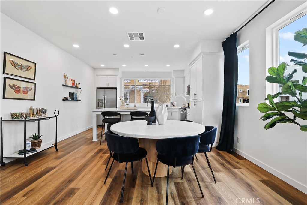 42 Bigsby Drive Stanton, CA 90680 - Photo 19 of 40 a view of a dining room with furniture and wooden floor