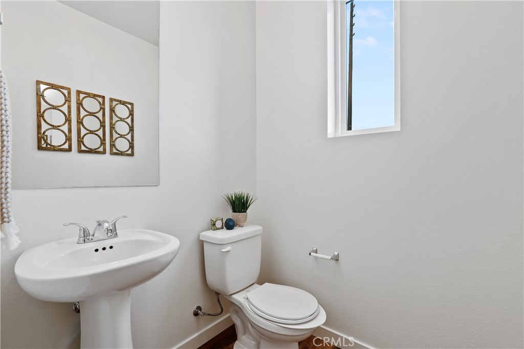 42 Bigsby Drive Stanton, CA 90680 - Photo 27 of 40 a bathroom with a toilet sink and mirror