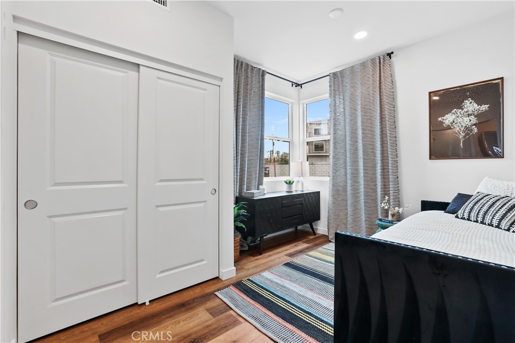 42 Bigsby Drive Stanton, CA 90680 - Photo 3 of 40 a bedroom with a bed and wooden floor