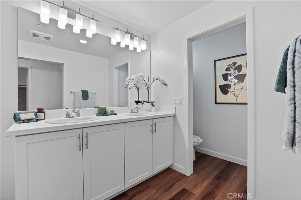 42 Bigsby Drive Stanton, CA 90680 - Photo 37 of 40 a bathroom with a double vanity sink and a mirror