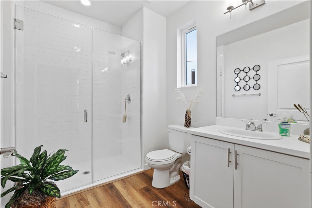 42 Bigsby Drive Stanton, CA 90680 - Photo 5 of 40 a bathroom with a sink toilet a mirror and shower