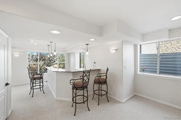 a kitchen with a table and chairs in it