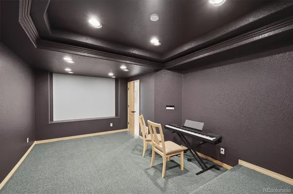 a workspace with wooden floor and furniture