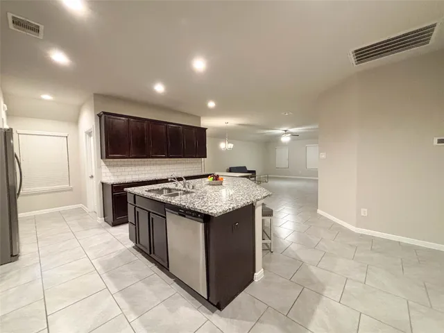 a kitchen with a stove and a microwave