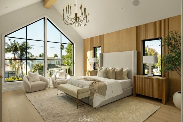 a bedroom with a bed couch and window