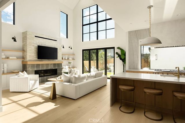 a living room with fireplace furniture and a flat screen tv