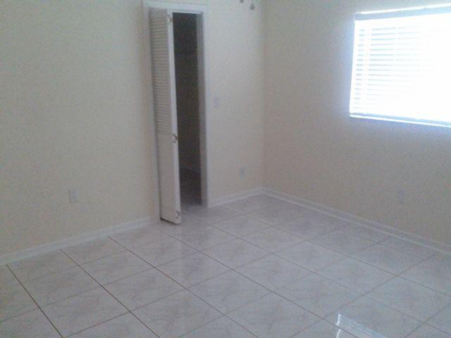 10965 Christopher Avenue Boca Raton, FL 33428 - Photo 11 of 25 an empty room with a window