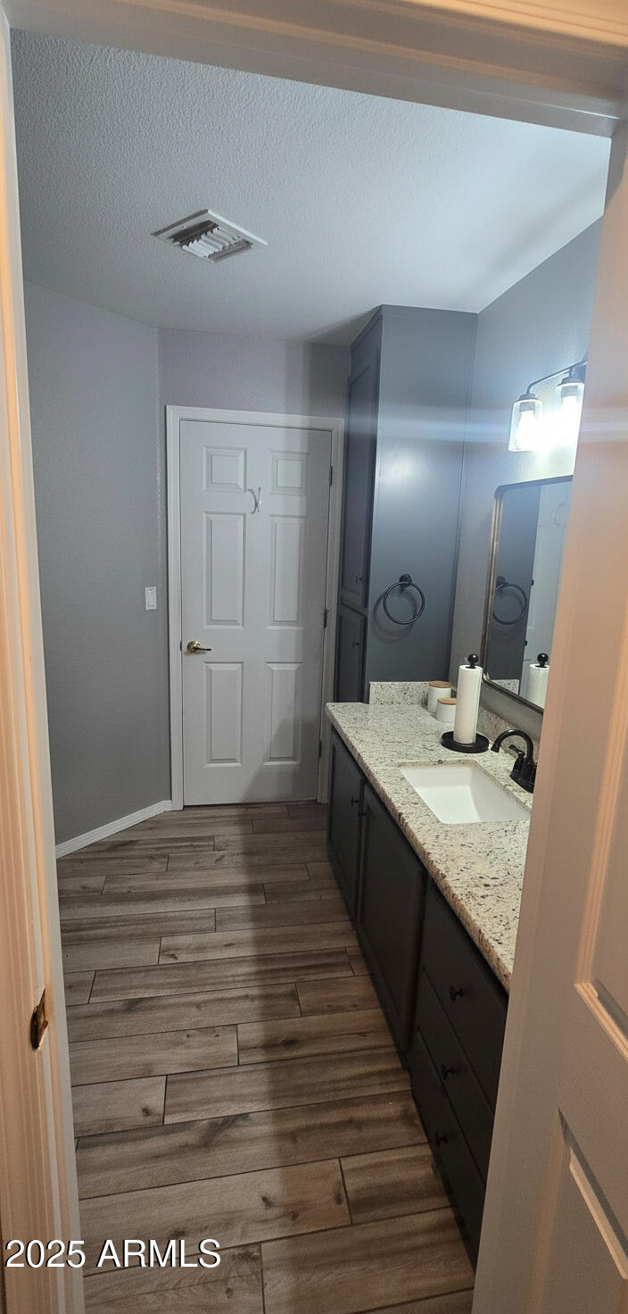 1502 South Prospectors Road Apache Junction, AZ 85119 - Photo 22 of 77 a bathroom with a granite countertop sink