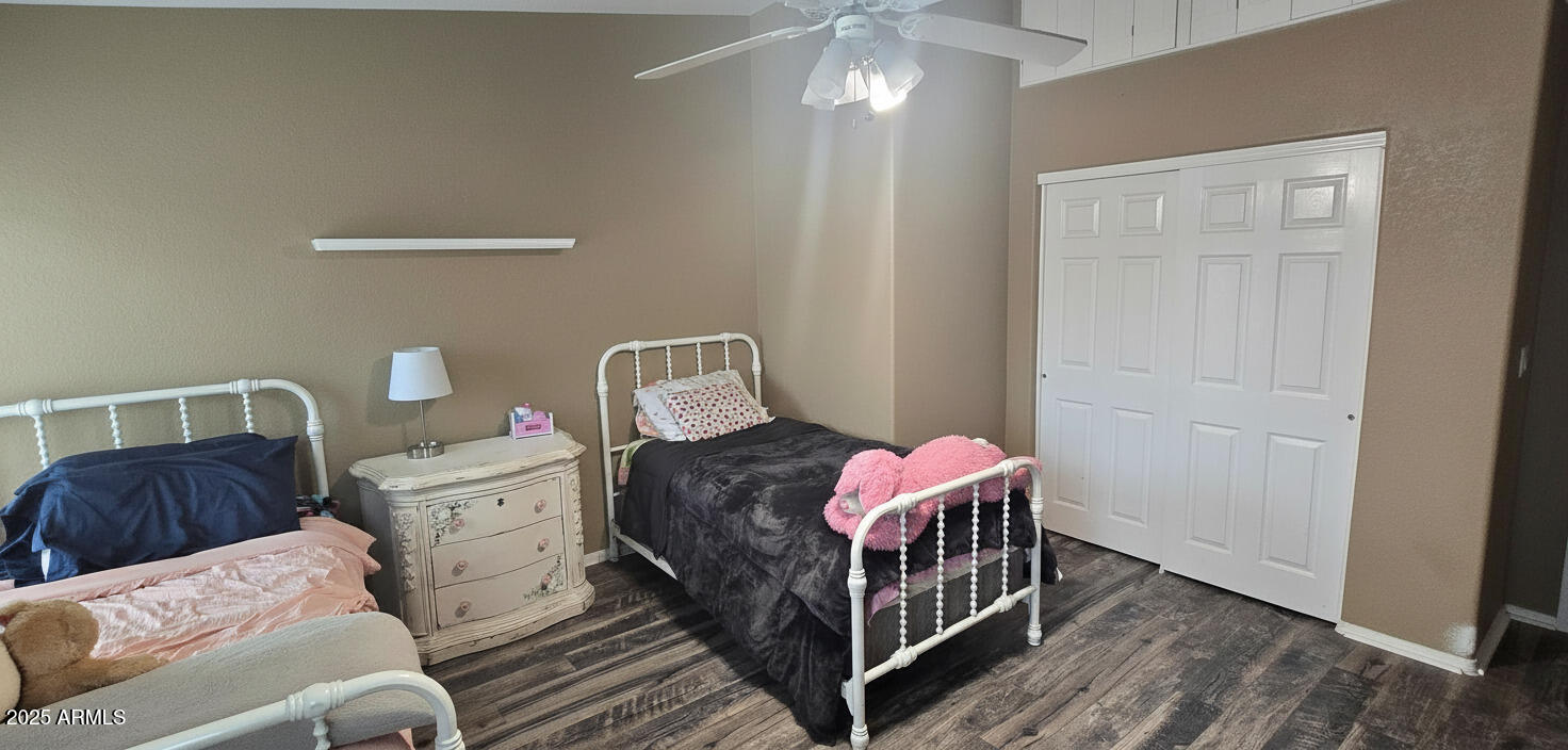 1502 South Prospectors Road Apache Junction, AZ 85119 - Photo 24 of 77 a bedroom with a bed and wooden floor
