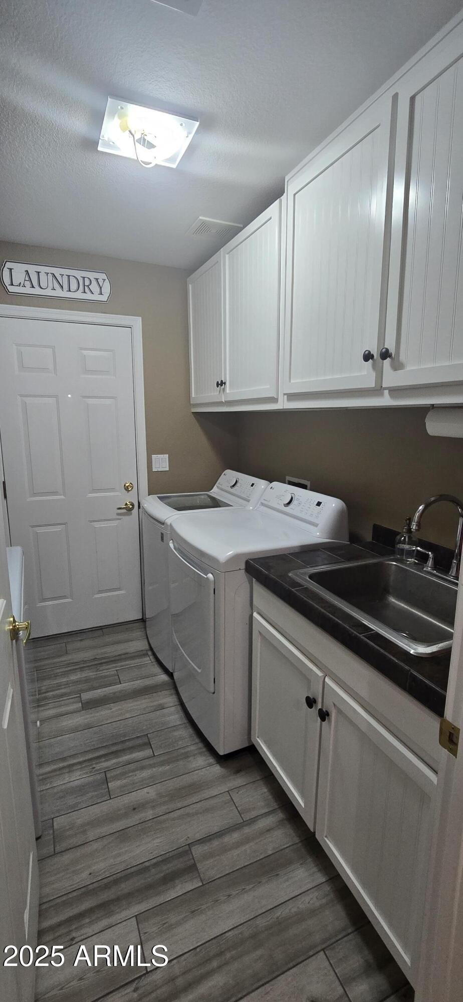 1502 South Prospectors Road Apache Junction, AZ 85119 - Photo 26 of 77 a room with a sink cabinets and utility room
