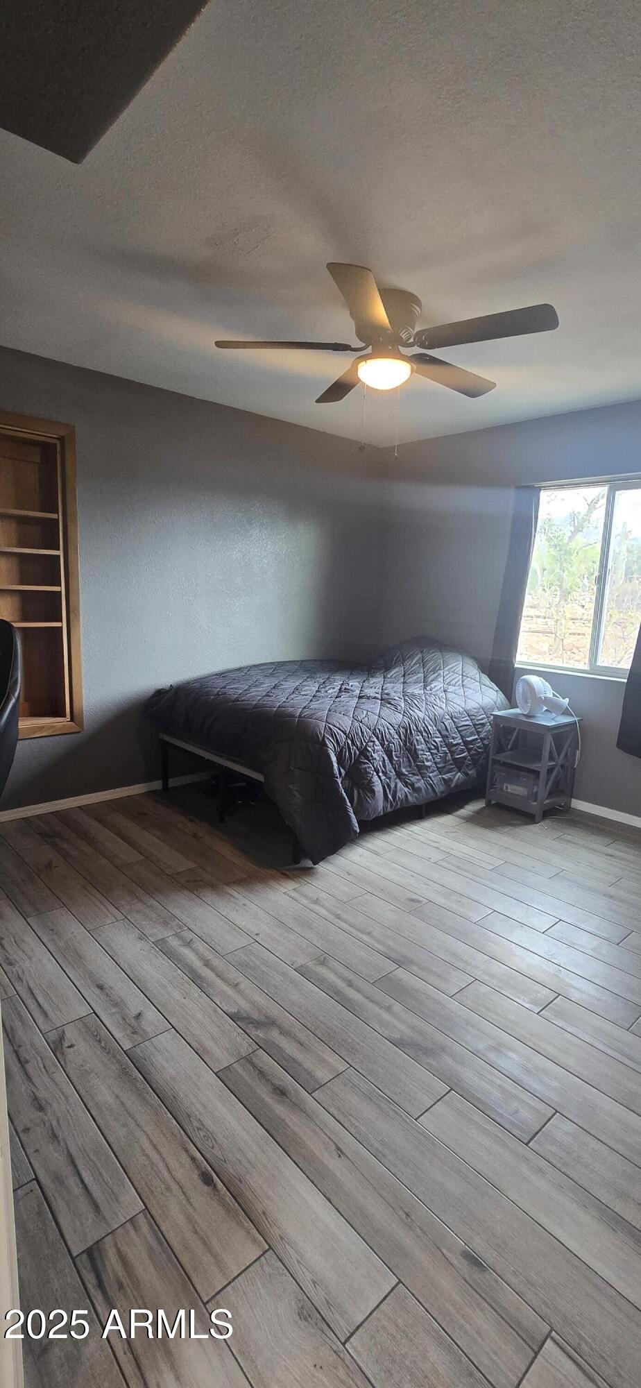 1502 South Prospectors Road Apache Junction, AZ 85119 - Photo 31 of 77 a bedroom with a bed and window