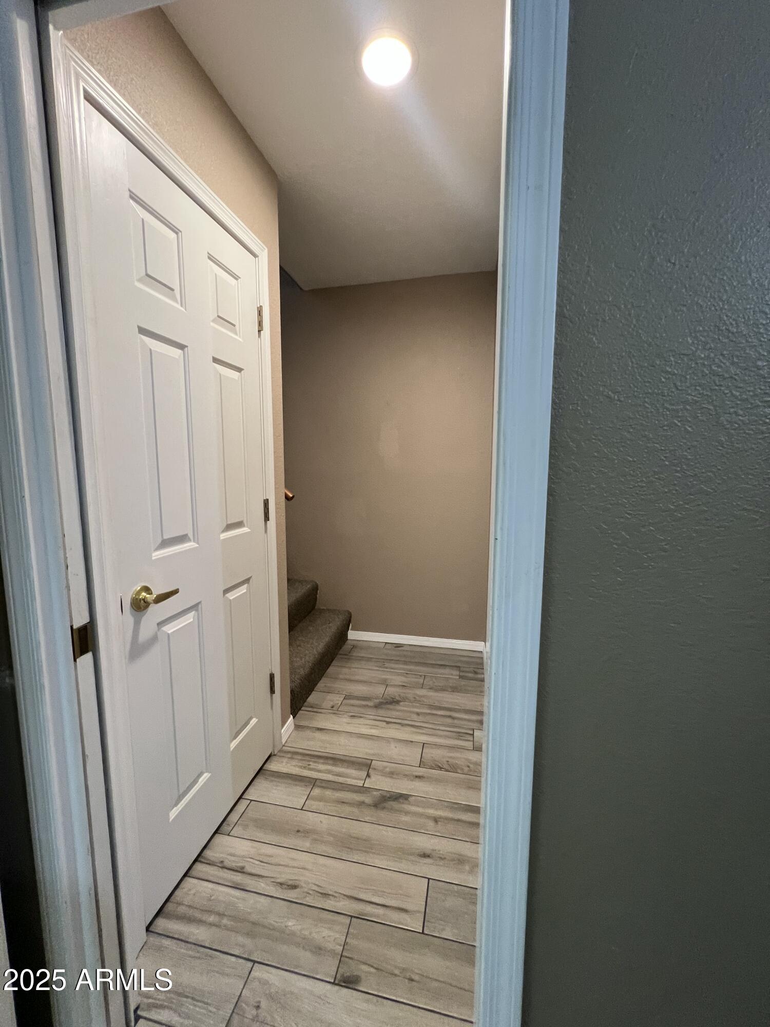 1502 South Prospectors Road Apache Junction, AZ 85119 - Photo 38 of 77 a view of a hallway with wooden floor