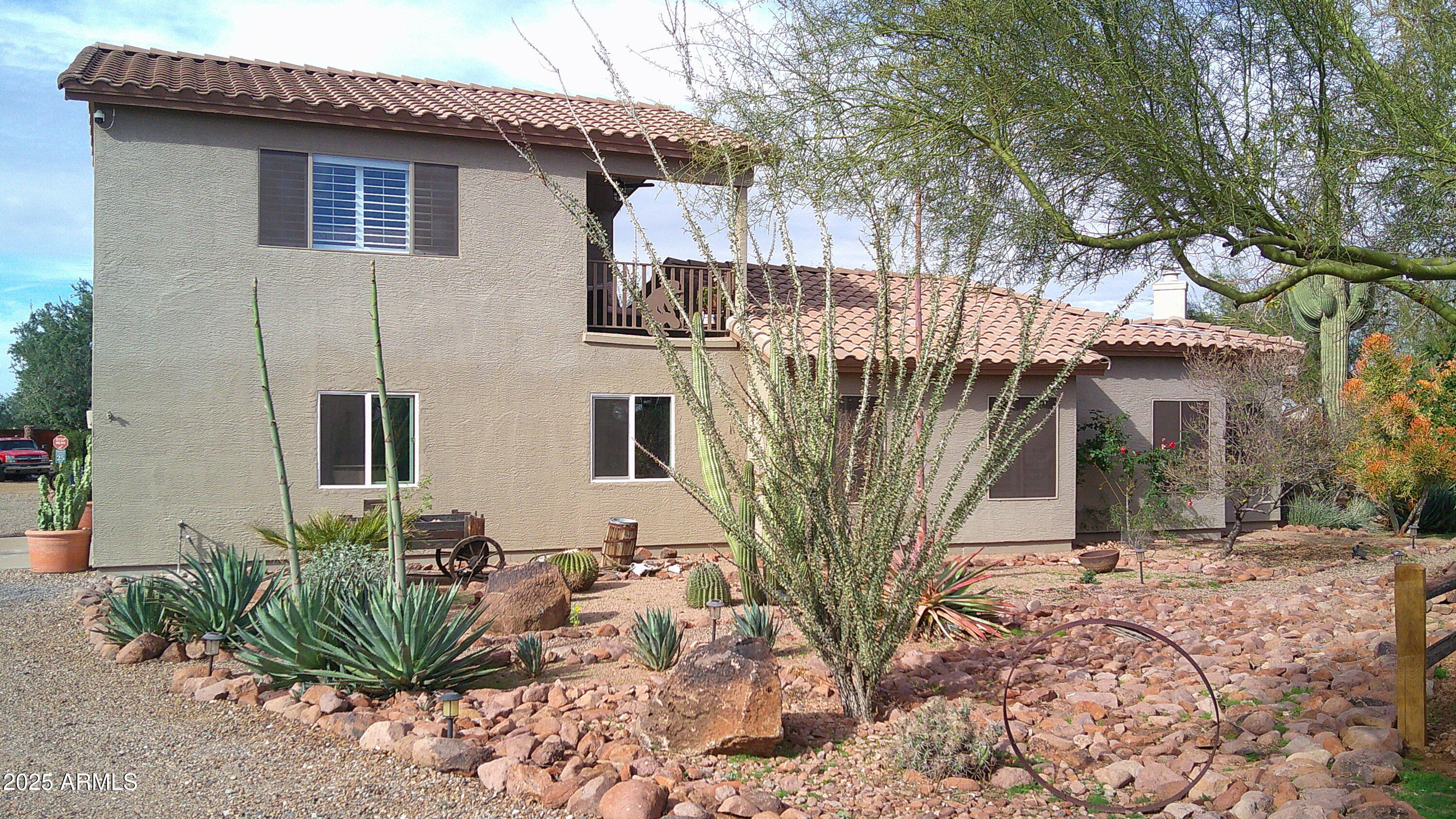 1502 South Prospectors Road Apache Junction, AZ 85119 - Photo 4 of 77 a view of a house with backyard and sitting area