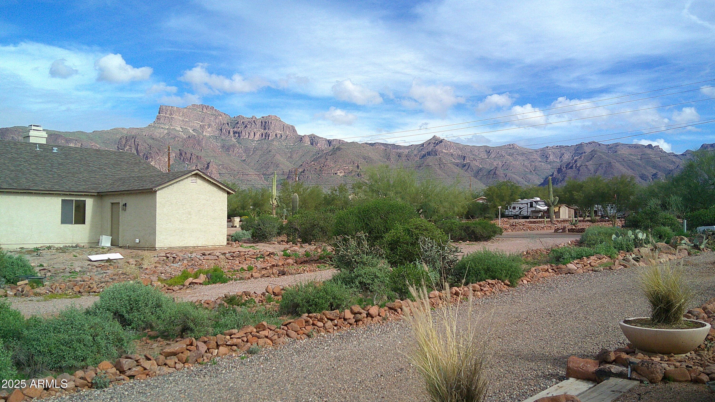 1502 South Prospectors Road Apache Junction, AZ 85119 - Photo 58 of 77 a view of a house with a yard and large tree