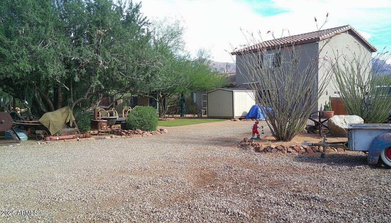 1502 South Prospectors Road Apache Junction, AZ 85119 - Photo 59 of 77 a view of a house with backyard and sitting area