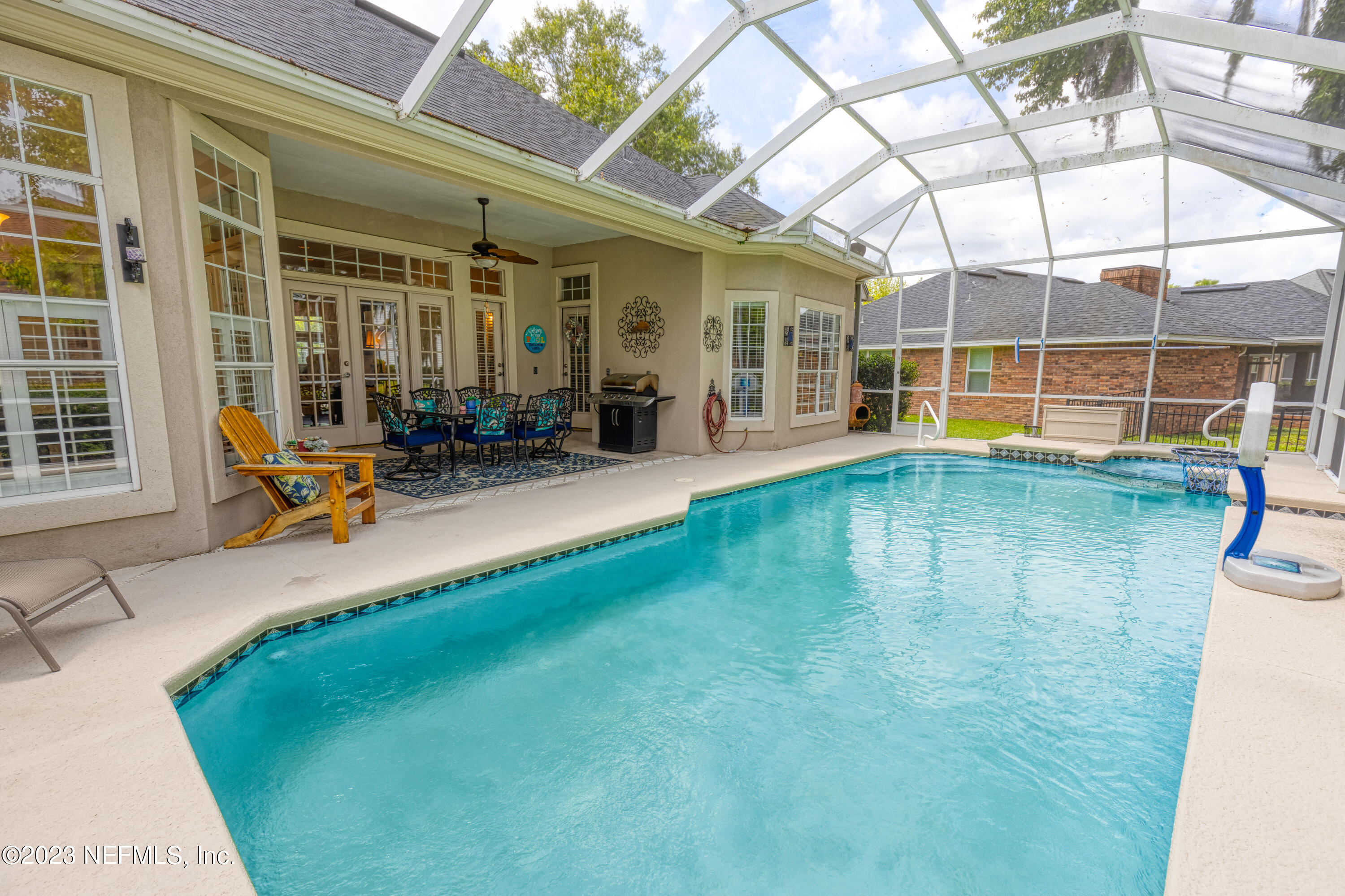 a view of a house with backyard porch and sitting area