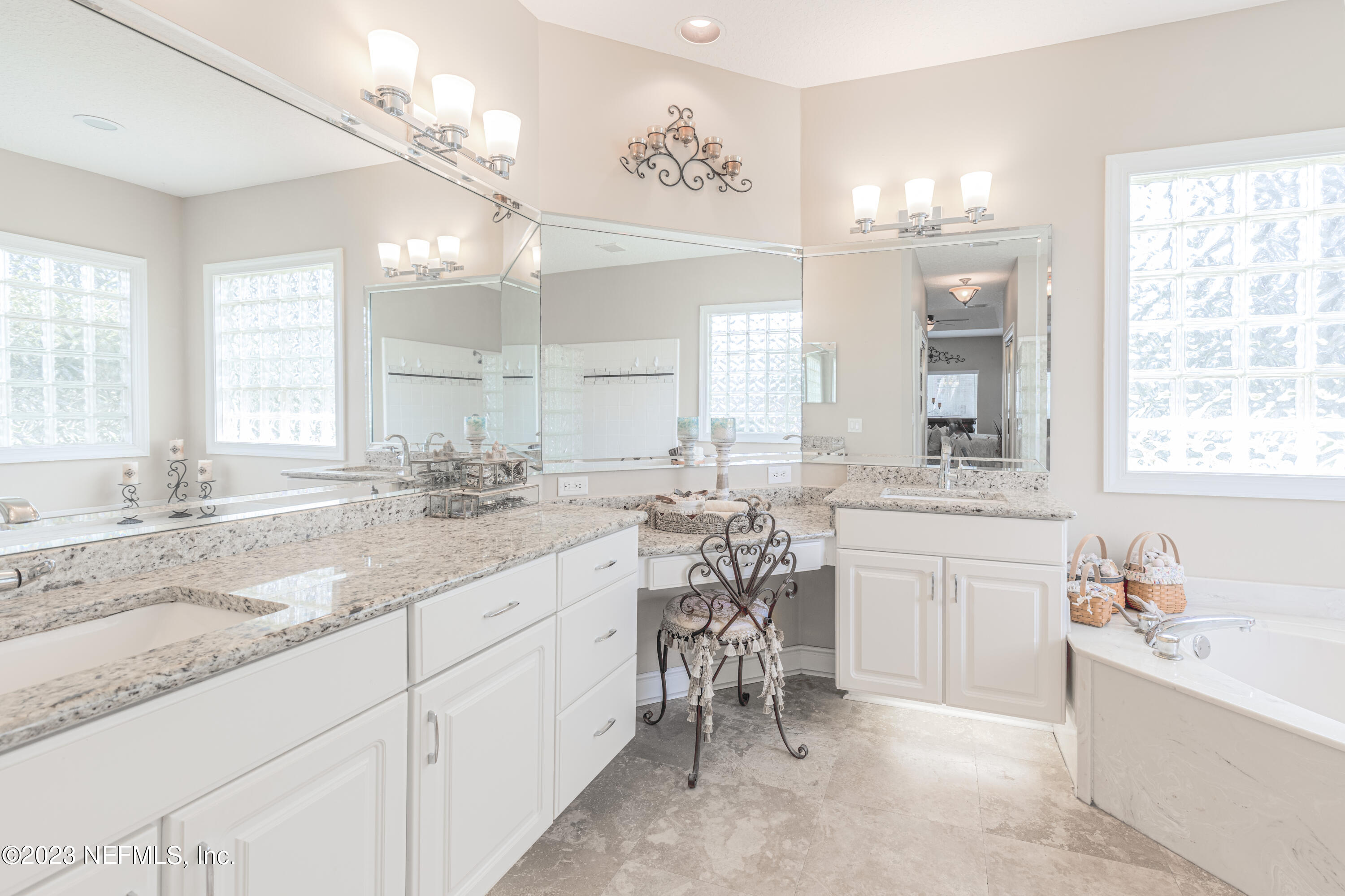 729 Cherry Grove Road Orange Park, FL 32073 - Photo 18 of 47 a bathroom with a granite countertop sink mirror and a bathtub