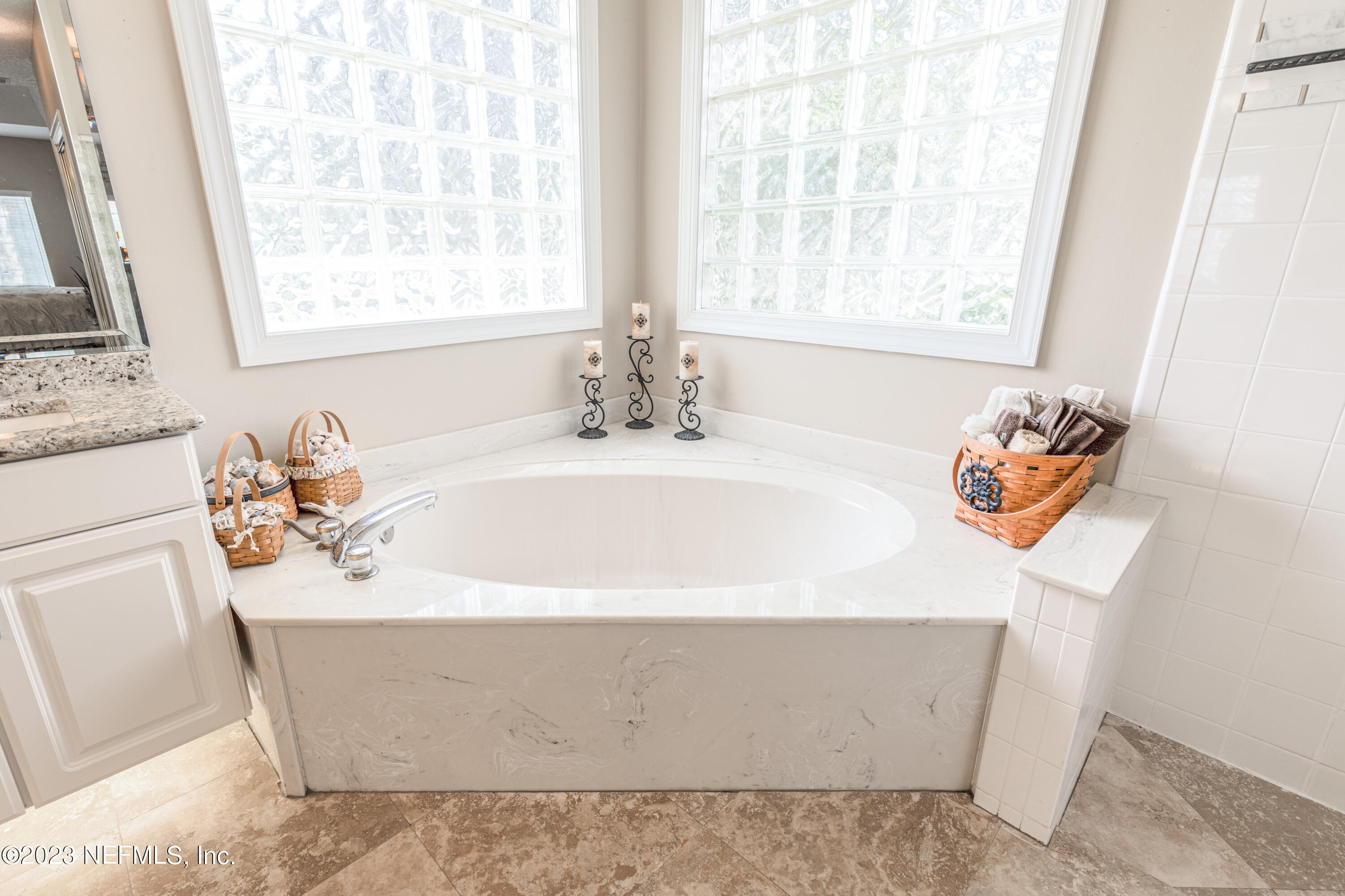 729 Cherry Grove Road Orange Park, FL 32073 - Photo 19 of 47 a bathroom with a sink a bathtub and a window