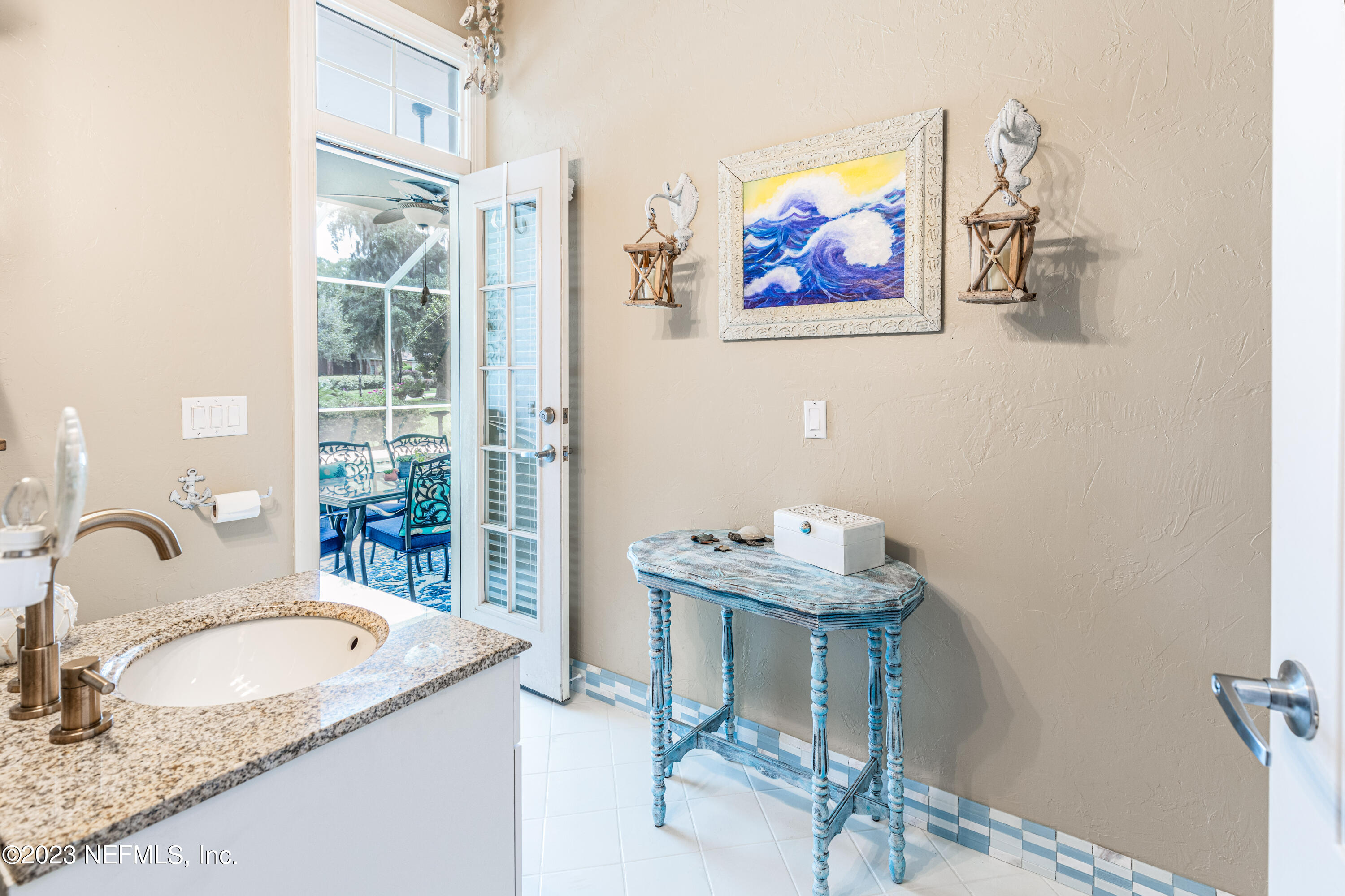 729 Cherry Grove Road Orange Park, FL 32073 - Photo 24 of 47 a bathroom with a granite countertop sink and a mirror