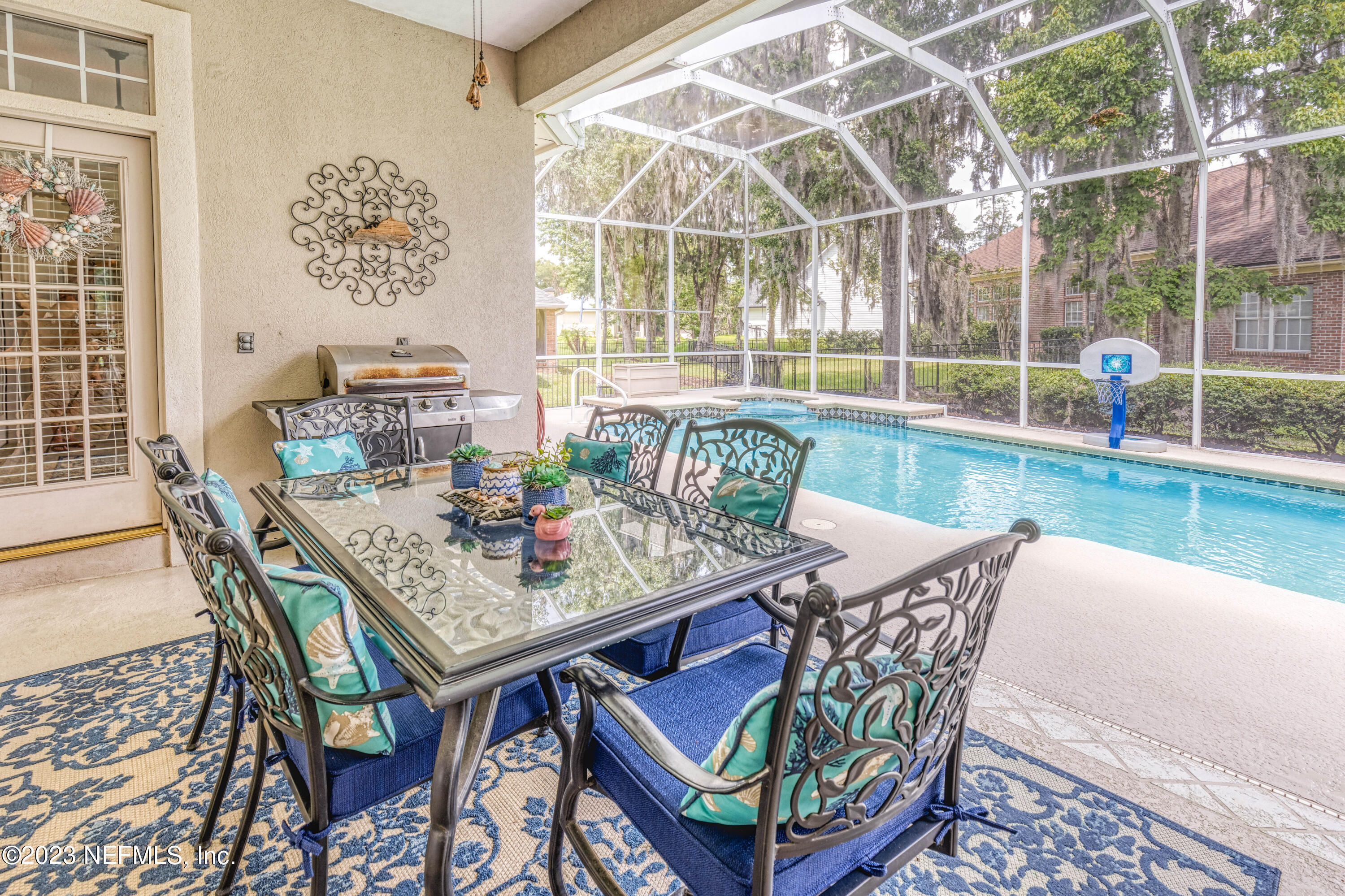 729 Cherry Grove Road Orange Park, FL 32073 - Photo 26 of 47 a view of a dining room with furniture wooden floor and a potted plant