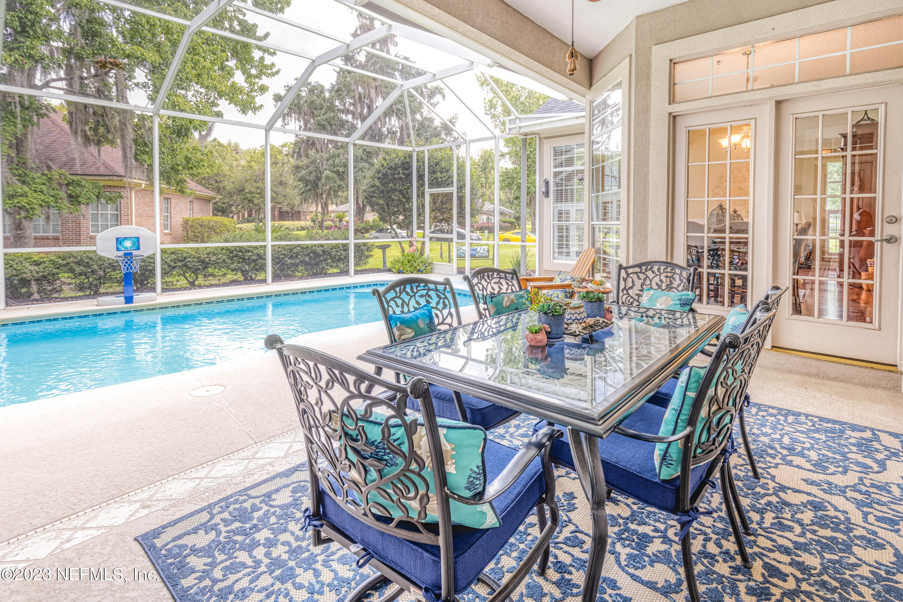 729 Cherry Grove Road Orange Park, FL 32073 - Photo 27 of 47 a view of a dining table and chairs in the patio