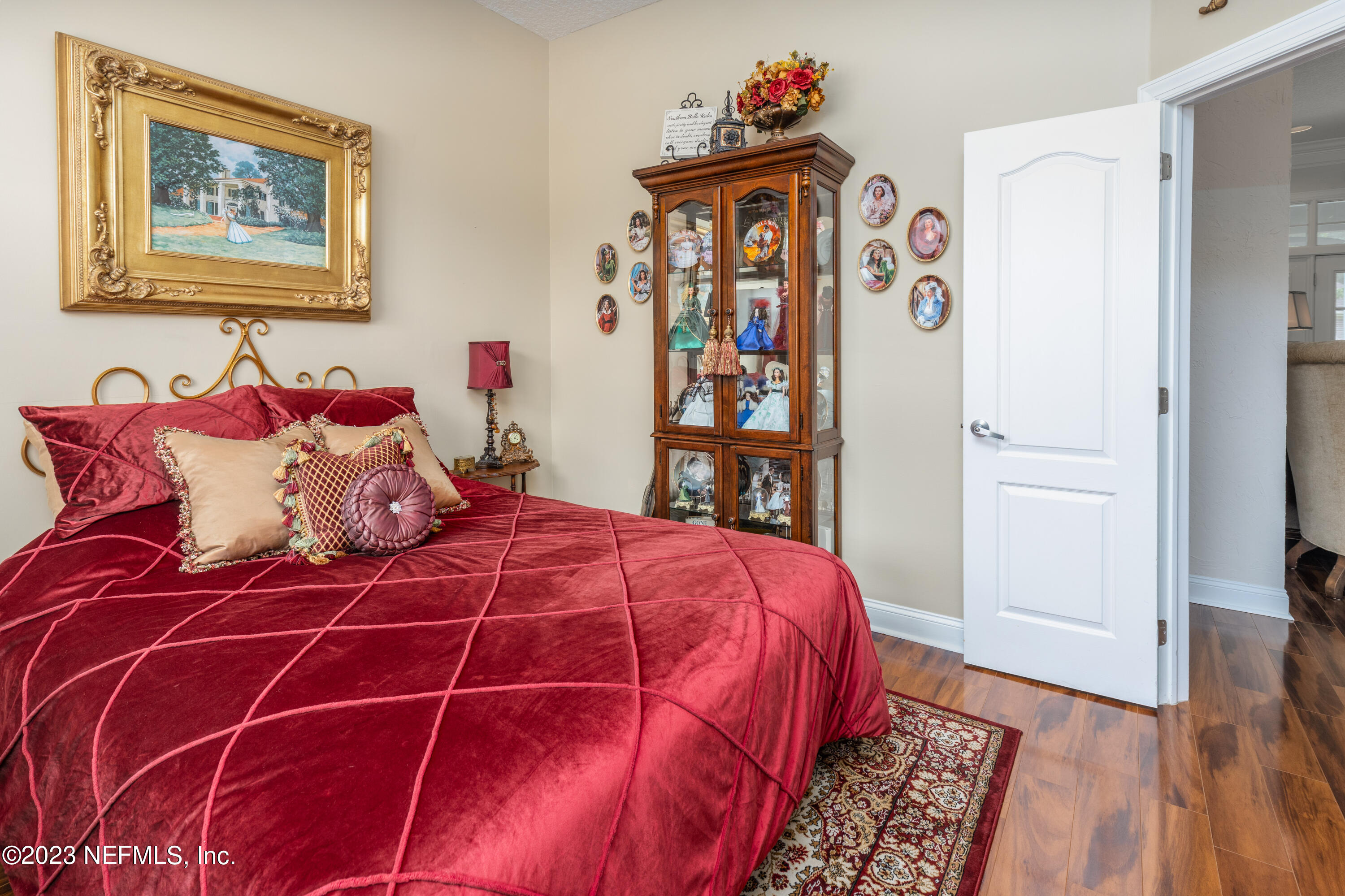 729 Cherry Grove Road Orange Park, FL 32073 - Photo 29 of 47 a bedroom with a bed and wooden floor