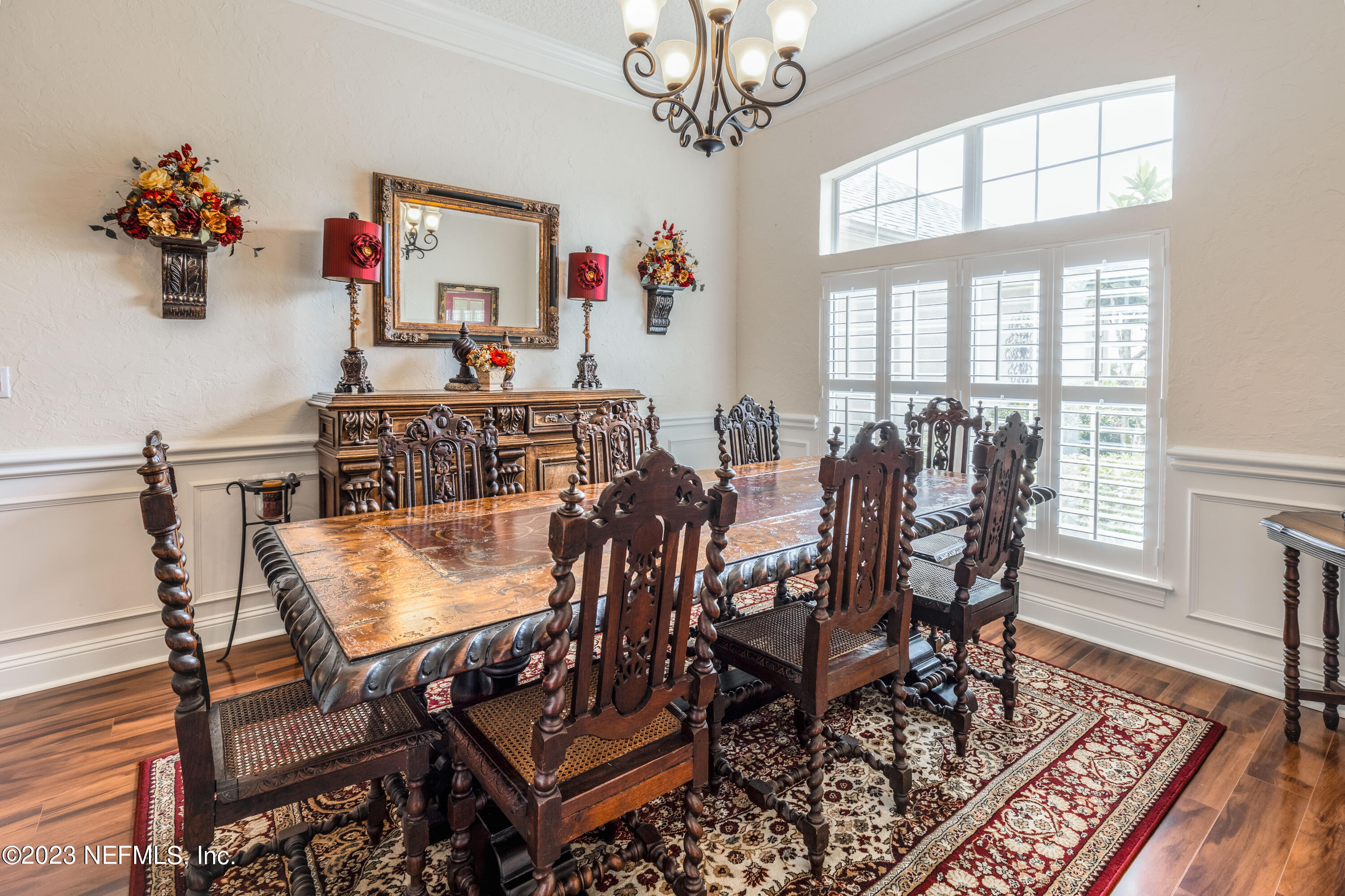 729 Cherry Grove Road Orange Park, FL 32073 - Photo 3 of 47 a view of a dining room with furniture a chandelier and wooden floor