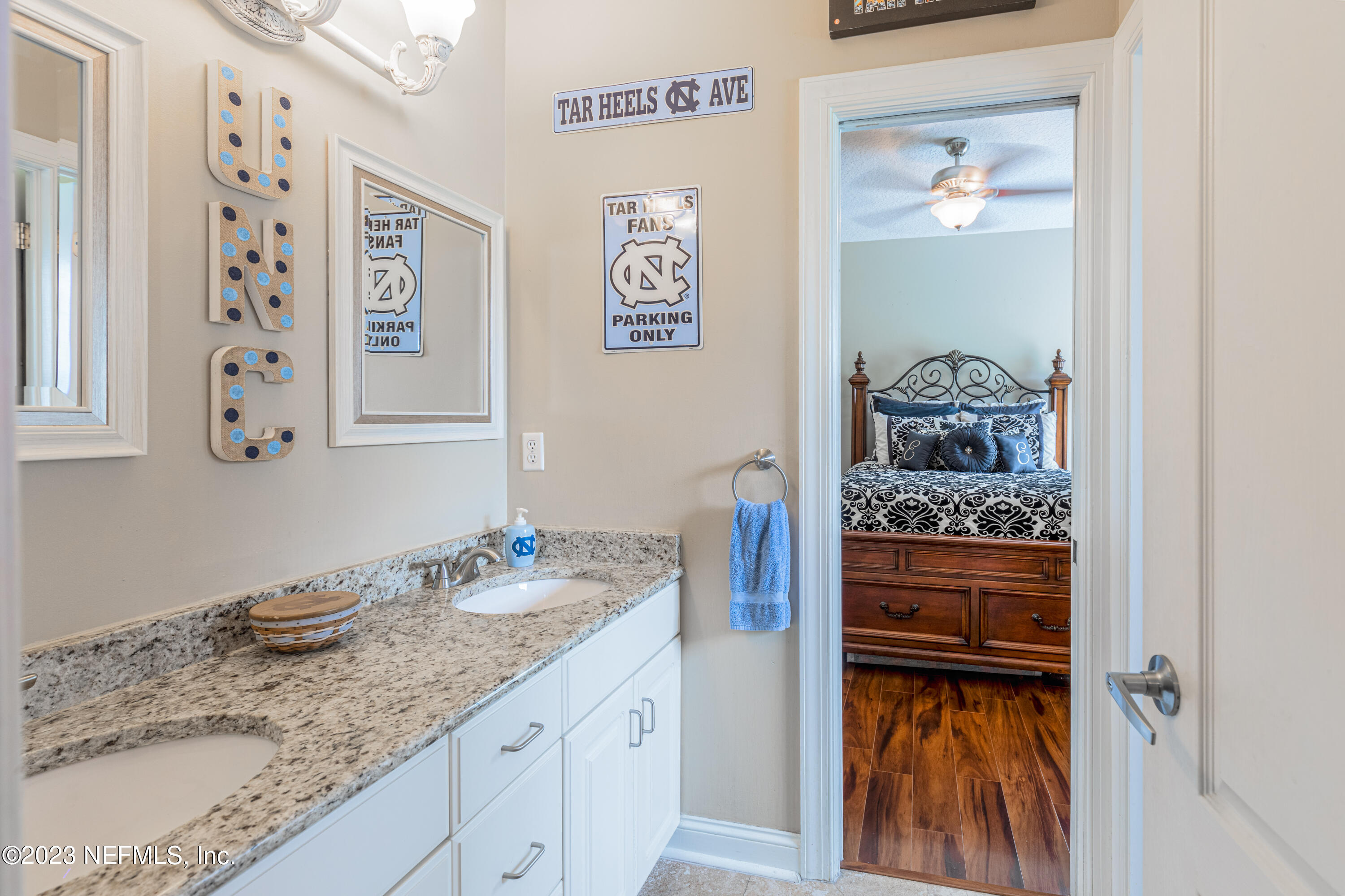 729 Cherry Grove Road Orange Park, FL 32073 - Photo 31 of 47 a bathroom with a granite countertop sink and a mirror
