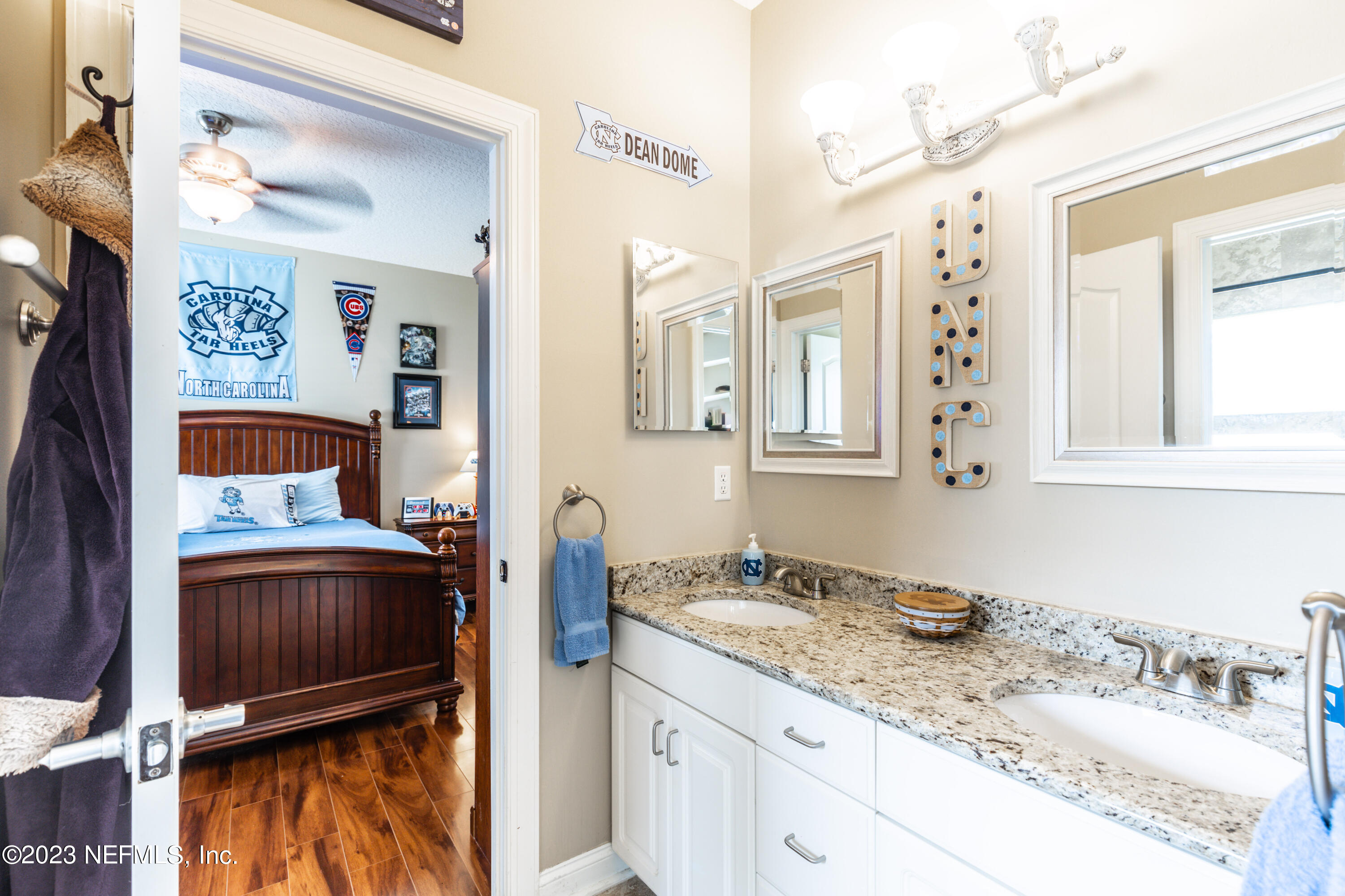 729 Cherry Grove Road Orange Park, FL 32073 - Photo 32 of 47 a bathroom with a sink a vanity and a mirror