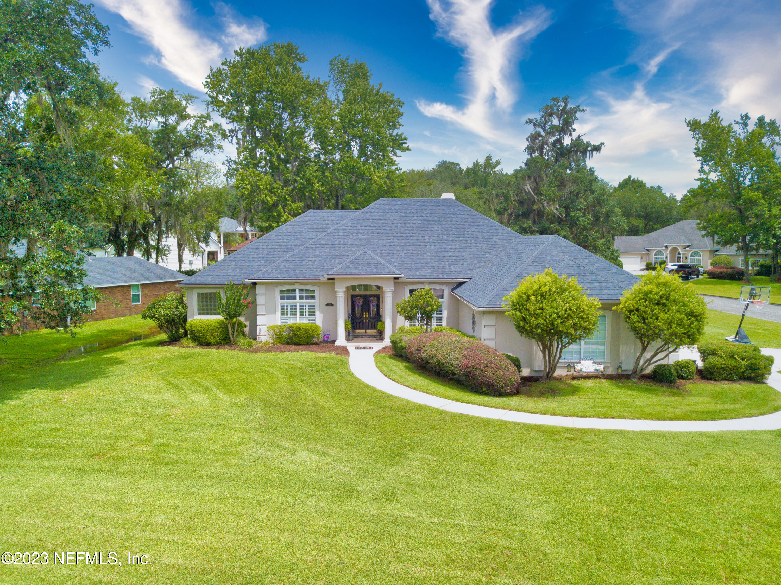 729 Cherry Grove Road Orange Park, FL 32073 - Photo 37 of 47 a view of a house with a yard