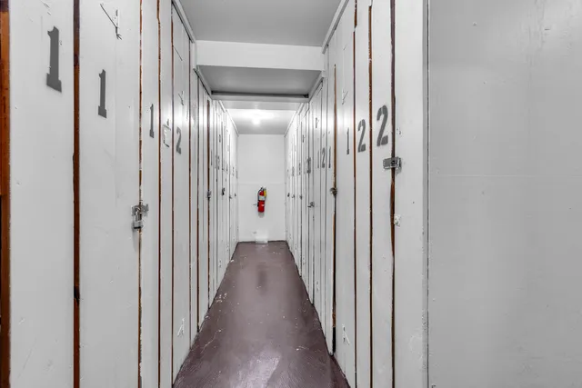 a view of a hallway with a door