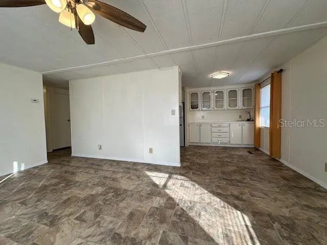 a view of a kitchen with a sink and dishwasher kitchen view with wooden floor