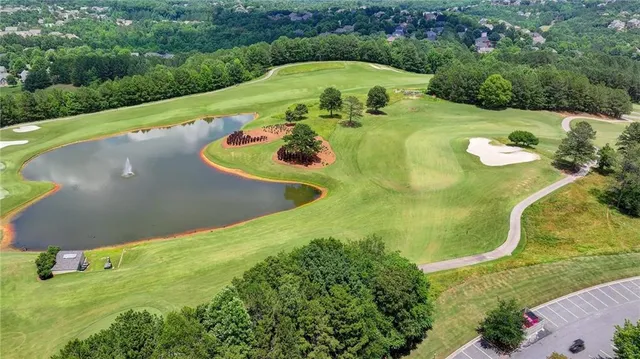 a view of a swimming pool with a yard