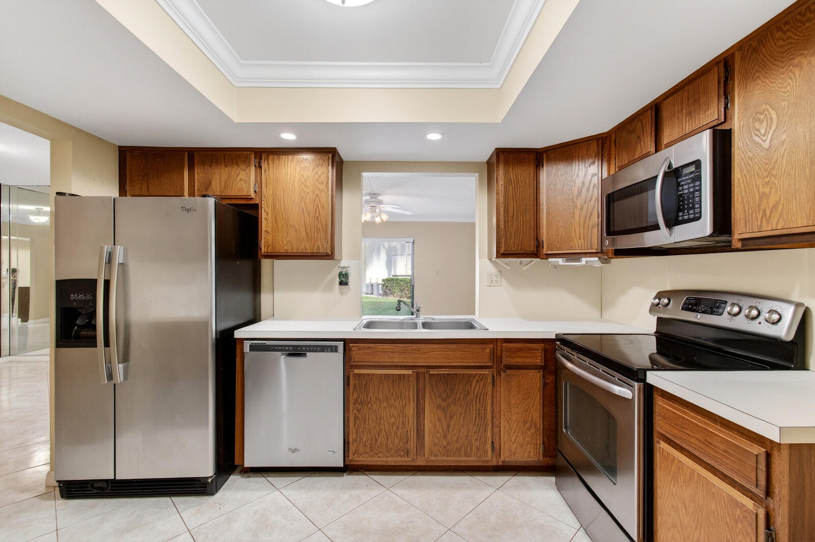 3951 Northeast 19th Road, Unit 1701 Pompano Beach, FL 33064 - Photo 37 of 82 a kitchen with stainless steel appliances granite countertop a stove a sink and a refrigerator