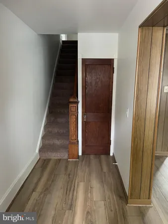 a view of entryway with wooden floor