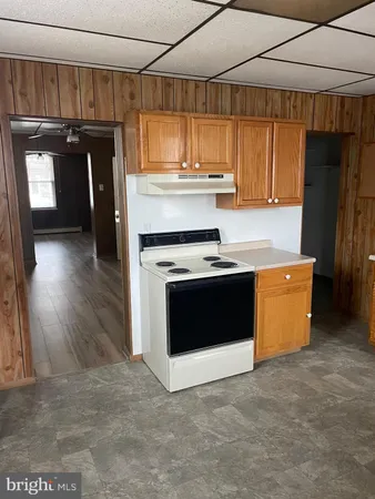 a kitchen with a stove and a refrigerator