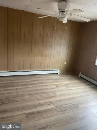 a view of room with hardwood floor