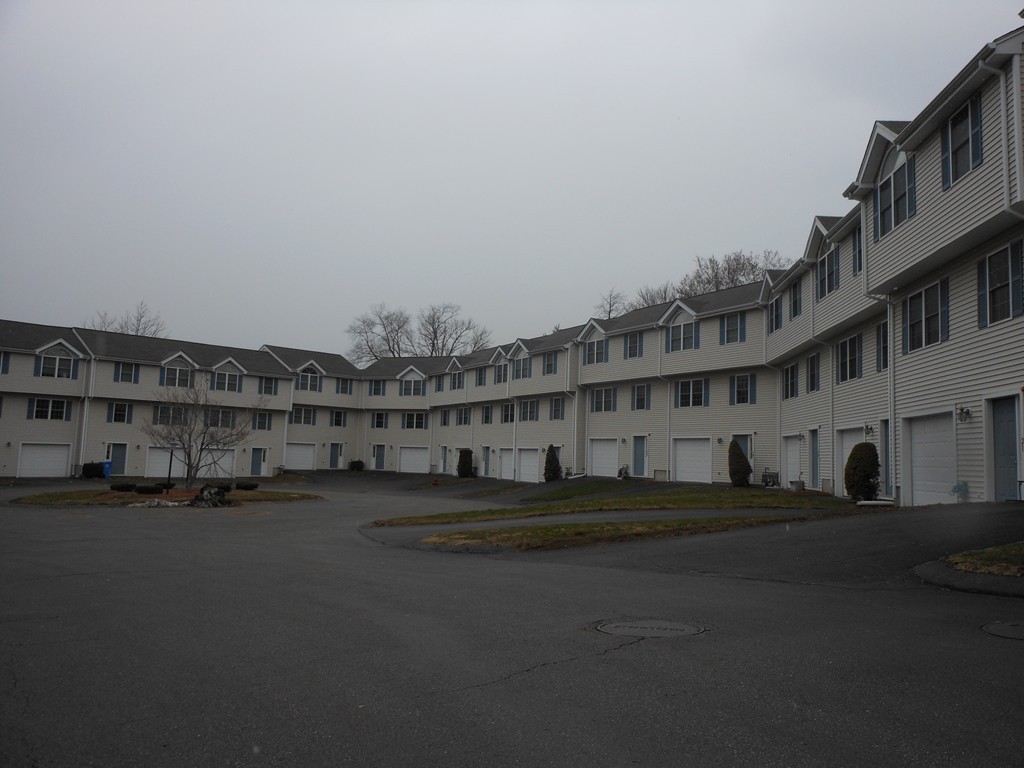 985 Trapelo Road, Unit 20 Waltham, MA 02452 - Photo 16 of 16 a big building with trees in front of it