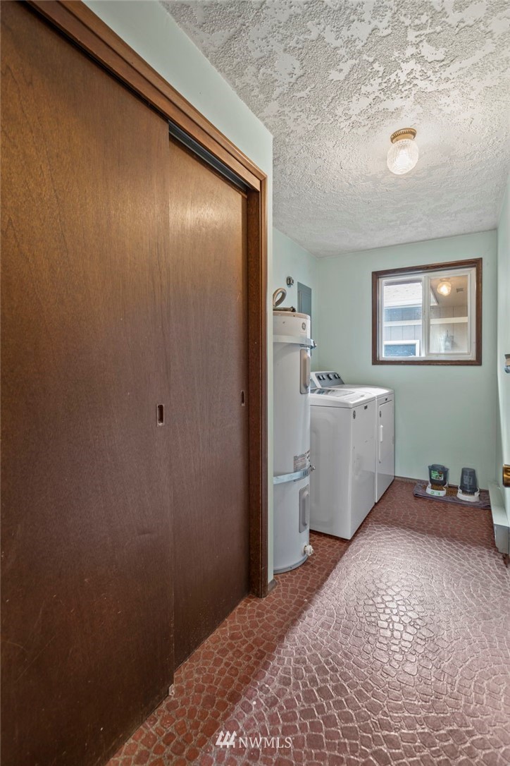167 Hillcrest Road Chehalis, WA 98532 - Photo 12 of 26 a bedroom with a bed and a refrigerator
