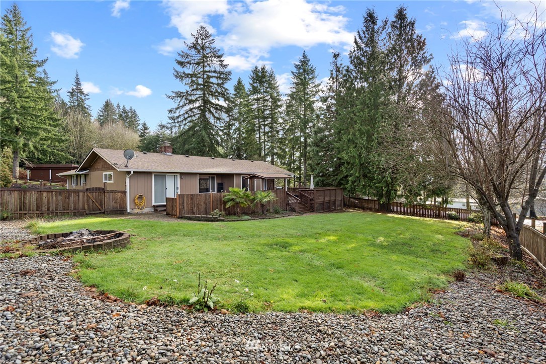 167 Hillcrest Road Chehalis, WA 98532 - Photo 24 of 26 a view of a house with a yard and hanging chair