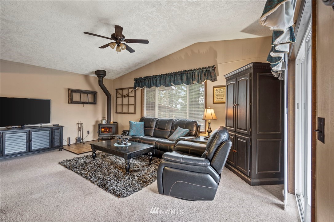 167 Hillcrest Road Chehalis, WA 98532 - Photo 5 of 26 a living room with furniture and a flat screen tv