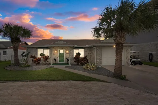 a view of a house with backyard space and porch