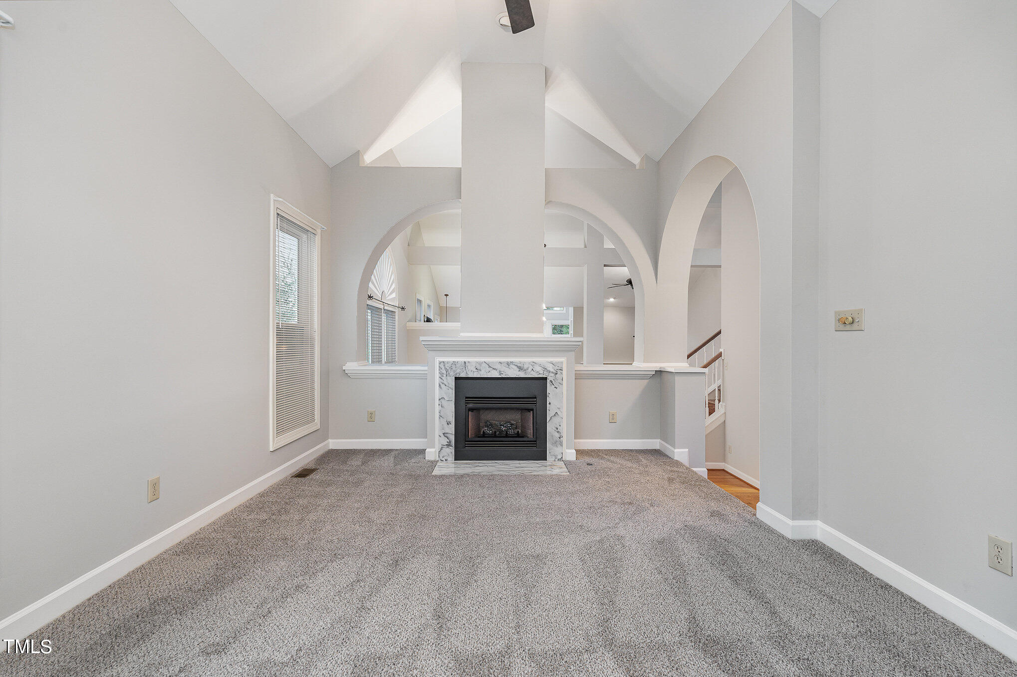 305 Fairwinds Drive Cary, NC 27518 - Photo 8 of 27 wooden floor fireplace and windows in an empty room