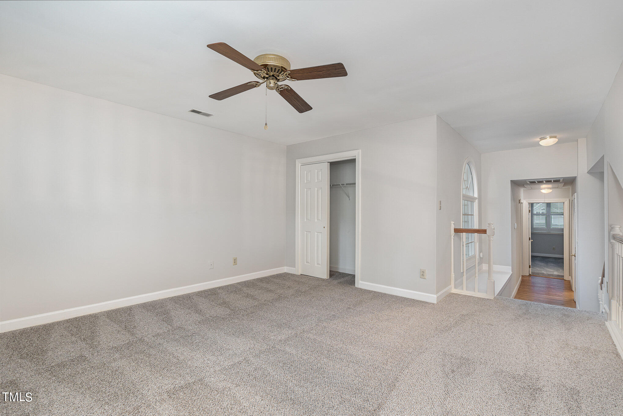 305 Fairwinds Drive Cary, NC 27518 - Photo 12 of 27 a view of a livingroom with a ceiling fan and window