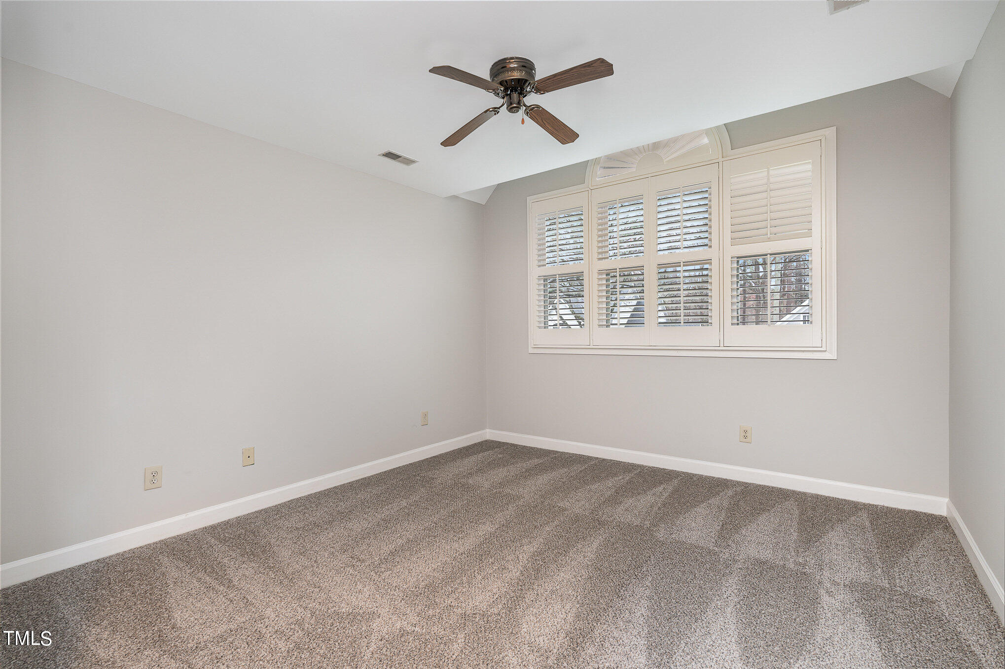 305 Fairwinds Drive Cary, NC 27518 - Photo 13 of 27 a view of an empty room with a window