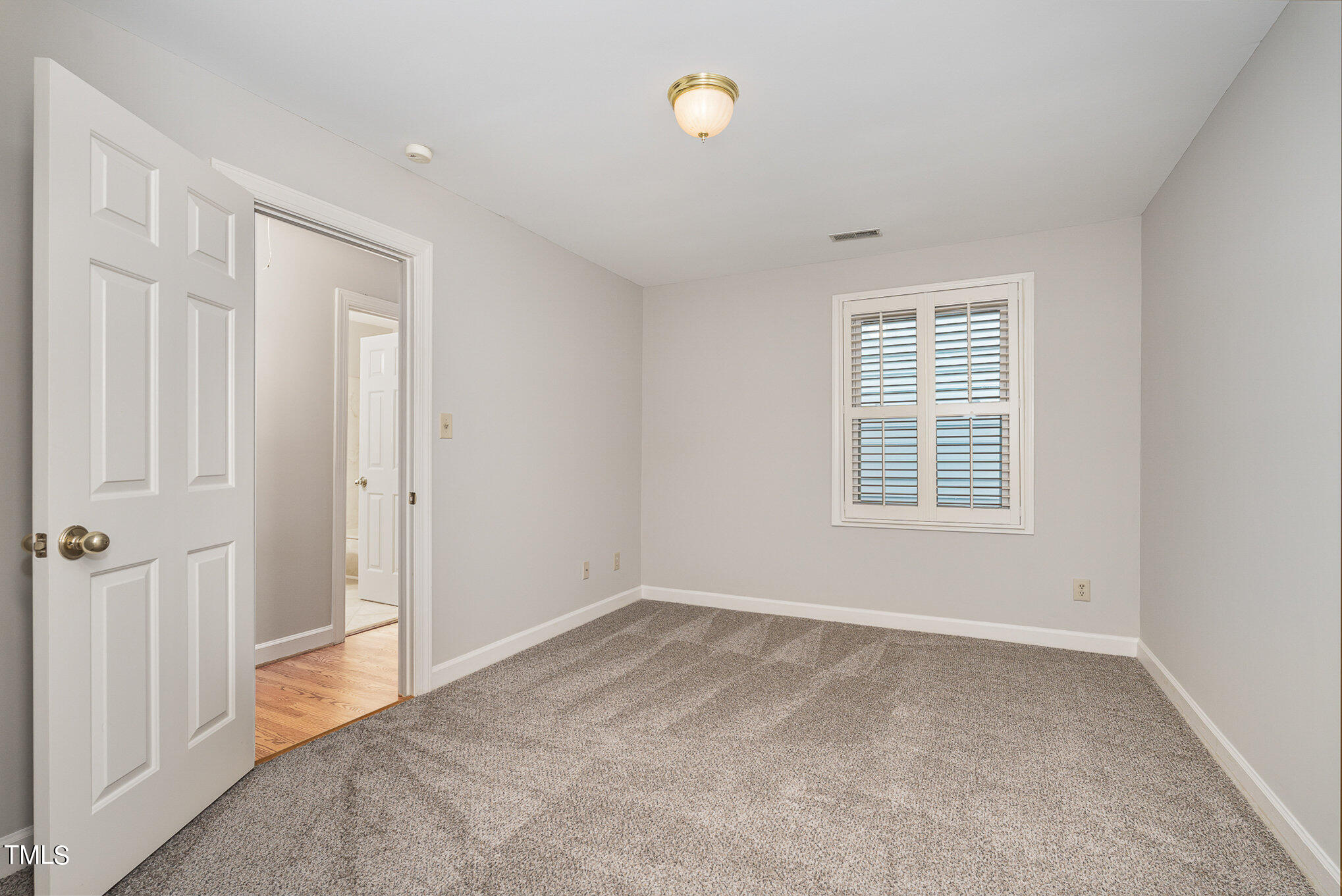 305 Fairwinds Drive Cary, NC 27518 - Photo 14 of 27 an empty room with windows